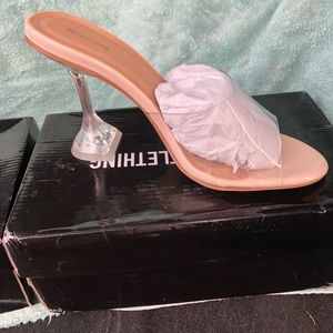 Clear heeled mules